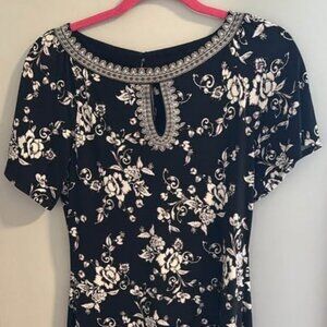 White House Black Market xs black dress with white and purple flowers.